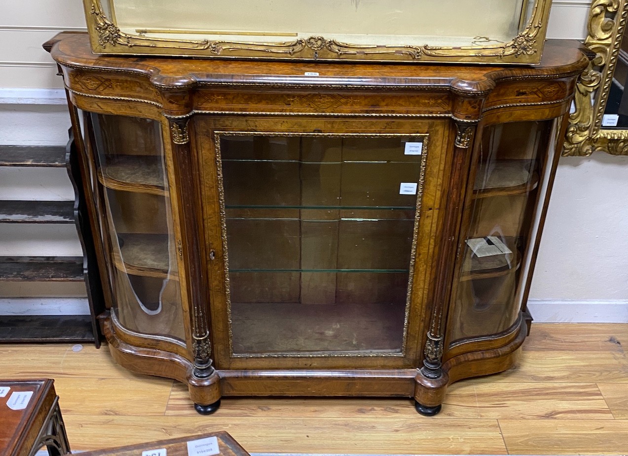 A Victorian gilt metal mounted burr walnut serpentine credenza, width 148cm, depth 44cm, height 105cm
